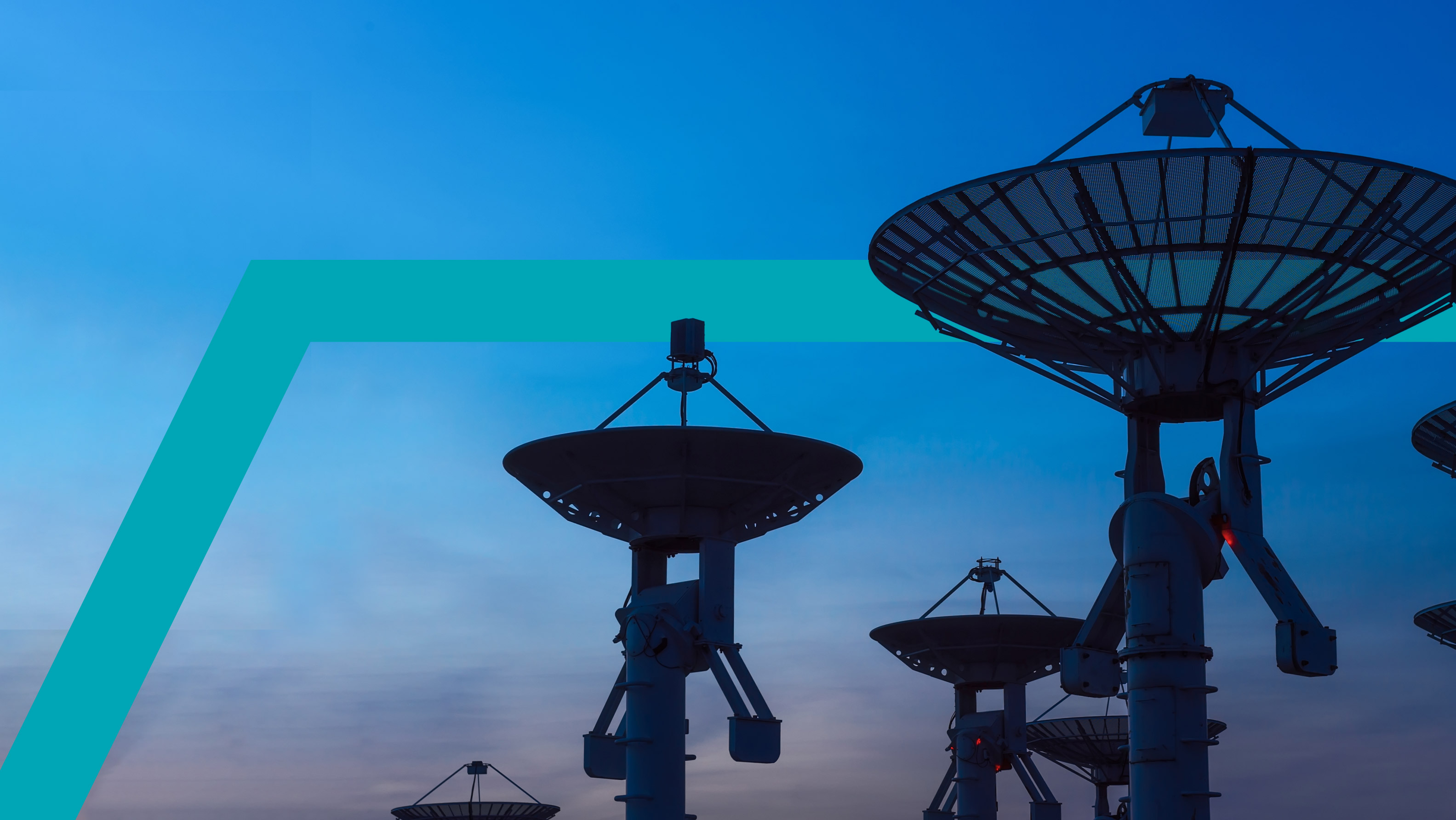 woman working at a computer with satellite dishes